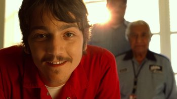 Movie still from “The Terminal” (2004), directed by Steven Spielberg – A person with a beard and mustache; Close Up shot, Low angle