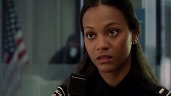 Movie still from “The Terminal” (2004), directed by Steven Spielberg – A person holding a cell phone; Close Up shot, Over the shoulder angle