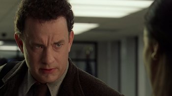 Movie still from “The Terminal” (2004), directed by Steven Spielberg – A man with a frowning look on his face; Close Up shot, Low angle