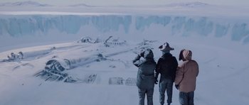 Movie still from “The Thing” (1982), directed by John Carpenter – Two people standing in the middle of an ice field; Extreme Wide shot, High angle