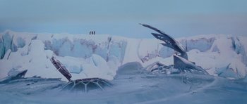 Movie still from “The Thing” (1982), directed by John Carpenter – Two people are standing on the edge of a frozen lake; Extreme Wide shot, High angle