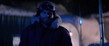 Movie still from “The Thing” (1982), directed by John Carpenter – A man wearing a winter coat and goggles; Close Up shot, Low angle