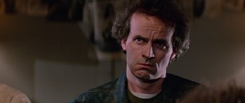 Movie still from “The Thing” (1982), directed by John Carpenter – A person wearing a jacket; Close Up shot, Low angle