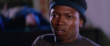 Movie still from “The Thing” (1982), directed by John Carpenter – A person wearing a headband; Close Up shot, Low angle