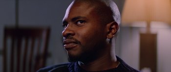 Movie still from “The Thing” (1982), directed by John Carpenter – A person with a beard looking to his left; Close Up shot, Low angle