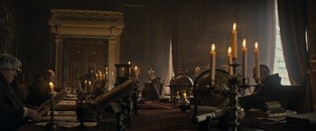 Movie still from “The Three Musketeers - Part I: D'Artagnan” (2023), directed by Martin Bourboulon – Many candles on the table in the room; Wide shot, High angle