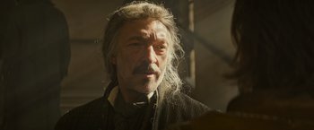 Movie still from “The Three Musketeers - Part I: D'Artagnan” (2023), directed by Martin Bourboulon – A person with a beard and mustache; Close Up shot, Low angle