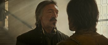 Movie still from “The Three Musketeers - Part I: D'Artagnan” (2023), directed by Martin Bourboulon – An older man looking into a mirror while standing next to a younger man; Close Up shot, Over the shoulder angle