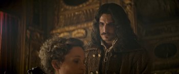 Movie still from “The Three Musketeers - Part I: D'Artagnan” (2023), directed by Martin Bourboulon – A man and a woman standing next to each other; Close Up shot, Over the shoulder angle