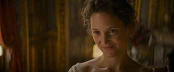 Movie still from “The Three Musketeers - Part I: D'Artagnan” (2023), directed by Martin Bourboulon – A person wearing a dress; Close Up shot, Over the shoulder angle