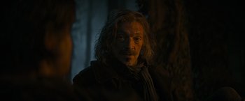 Movie still from “The Three Musketeers - Part I: D'Artagnan” (2023), directed by Martin Bourboulon – A person with long white hair; Close Up shot, Over the shoulder angle