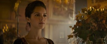 Movie still from “The Three Musketeers - Part I: D'Artagnan” (2023), directed by Martin Bourboulon – A beautiful young woman standing in front of a mirror; Close Up shot, Over the shoulder angle