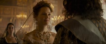 Movie still from “The Three Musketeers - Part I: D'Artagnan” (2023), directed by Martin Bourboulon – A woman in a wedding dress and a veil; Close Up shot, Over the shoulder angle
