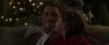 Movie still from “The Tomorrow War” (2021), directed by Chris McKay – A man and a little girl sitting next to a christmas tree; Close Up shot, Over the shoulder angle