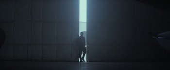 Movie still from “The Tomorrow War” (2021), directed by Chris McKay – A man standing in front of an opening in a building; Extreme Wide shot, Low angle