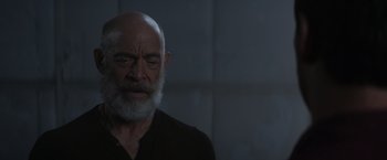 Movie still from “The Tomorrow War” (2021), directed by Chris McKay – An old man with a beard and a black shirt; Close Up shot, Low angle