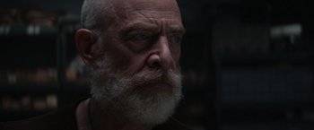 Movie still from “The Tomorrow War” (2021), directed by Chris McKay – An old man with a beard and a white mustache; Close Up shot, Low angle