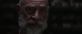 Movie still from “The Tomorrow War” (2021), directed by Chris McKay – An old man with a beard is looking at the camera; Close Up shot, Over the shoulder angle