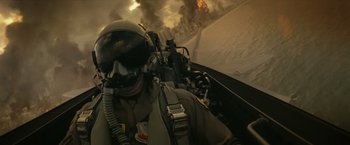 Movie still from “The Tomorrow War” (2021), directed by Chris McKay – A fighter jet flying through the air with smoke billowing in the background; Close Up shot, Low angle