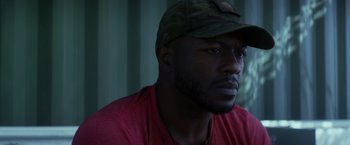 Movie still from “The Tomorrow War” (2021), directed by Chris McKay – A person wearing a hat; Close Up shot, Low angle