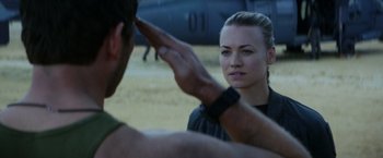 Movie still from “The Tomorrow War” (2021), directed by Chris McKay – A woman saluting a man in front of a helicopter; Close Up shot, Over the shoulder angle