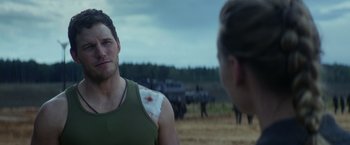 Movie still from “The Tomorrow War” (2021), directed by Chris McKay – A man with a bandage on his arm and a woman with a bandage on his shoulder; Close Up shot, Over the shoulder angle
