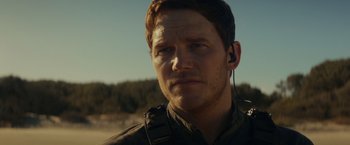 Movie still from “The Tomorrow War” (2021), directed by Chris McKay – A person wearing headphones; Close Up shot, Over the shoulder angle