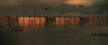 Movie still from “The Tomorrow War” (2021), directed by Chris McKay – An airplane flying over a body of water at night; Extreme Wide shot, High angle