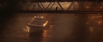 Movie still from “The Tomorrow War” (2021), directed by Chris McKay – A cruise ship on fire in a body of water; Extreme Wide shot, High angle