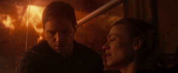 Movie still from “The Tomorrow War” (2021), directed by Chris McKay – A man and a woman sitting next to each other on a bus; Close Up shot, Over the shoulder angle