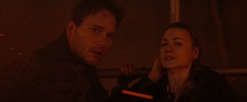 Movie still from “The Tomorrow War” (2021), directed by Chris McKay – A man and a woman looking at the camera; Close Up shot, Low angle