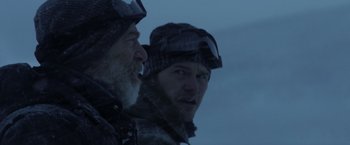 Movie still from “The Tomorrow War” (2021), directed by Chris McKay – Two men are looking at each other through a window; Close Up shot, Over the shoulder angle