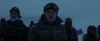 Movie still from “The Tomorrow War” (2021), directed by Chris McKay – A group of men standing next to each other in the dark; Close Up shot, Low angle