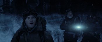 Movie still from “The Tomorrow War” (2021), directed by Chris McKay – Two men in the dark looking out of a window; Medium shot, Low angle