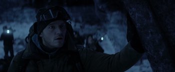 Movie still from “The Tomorrow War” (2021), directed by Chris McKay – A man wearing a helmet and a jacket; Close Up shot, Over the shoulder angle