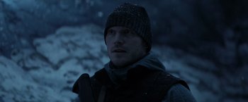 Movie still from “The Tomorrow War” (2021), directed by Chris McKay – A man wearing a hat and a jacket in the snow; Close Up shot, Low angle