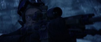 Movie still from “The Tomorrow War” (2021), directed by Chris McKay – A man with a rifle looking into the night sky; Close Up shot, Over the shoulder angle