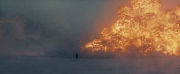 Movie still from “The Tomorrow War” (2021), directed by Chris McKay – A person on skis in front of an explosion in the sky; Extreme Wide shot, Over the shoulder angle