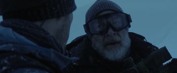 Movie still from “The Tomorrow War” (2021), directed by Chris McKay – A man wearing a hat and sunglasses talking to another man; Close Up shot, Over the shoulder angle