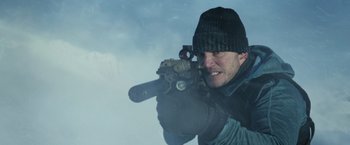 Movie still from “The Tomorrow War” (2021), directed by Chris McKay – A man holding a gun in his hands; Close Up shot, Low angle