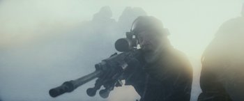 Movie still from “The Tomorrow War” (2021), directed by Chris McKay – A man with a rifle looking into the sky; Medium shot, Low angle