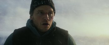 Movie still from “The Tomorrow War” (2021), directed by Chris McKay – A person wearing a jacket and a hat; Close Up shot, Low angle