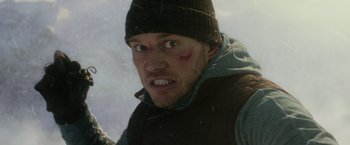 Movie still from “The Tomorrow War” (2021), directed by Chris McKay – A person wearing a jacket and hat; Close Up shot, Low angle