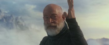Movie still from “The Tomorrow War” (2021), directed by Chris McKay – An old man with a beard and a white beard; Close Up shot, Low angle