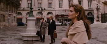 Movie still from “The Tourist” (2010), directed by Florian Henckel von Donnersmarck – A man and a woman walking down a street; Wide shot, Over the shoulder angle