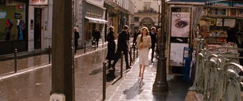 Movie still from “The Tourist” (2010), directed by Florian Henckel von Donnersmarck – A woman walking down the street in a white dress; Wide shot, Over the shoulder angle