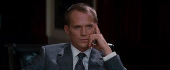 Movie still from “The Tourist” (2010), directed by Florian Henckel von Donnersmarck – A man in a suit and tie holding a cell phone to his ear; Close Up shot, High angle