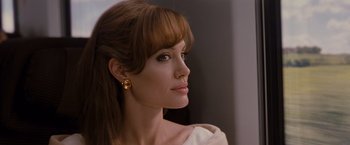 Movie still from “The Tourist” (2010), directed by Florian Henckel von Donnersmarck – A person wearing a white shirt; Close Up shot, Over the shoulder angle