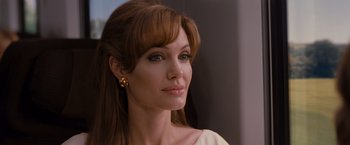 Movie still from “The Tourist” (2010), directed by Florian Henckel von Donnersmarck – A person with long brown hair; Close Up shot, Over the shoulder angle