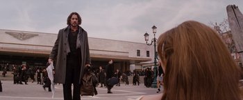 Movie still from “The Tourist” (2010), directed by Florian Henckel von Donnersmarck – A group of people walking down a street; Wide shot, Over the shoulder angle